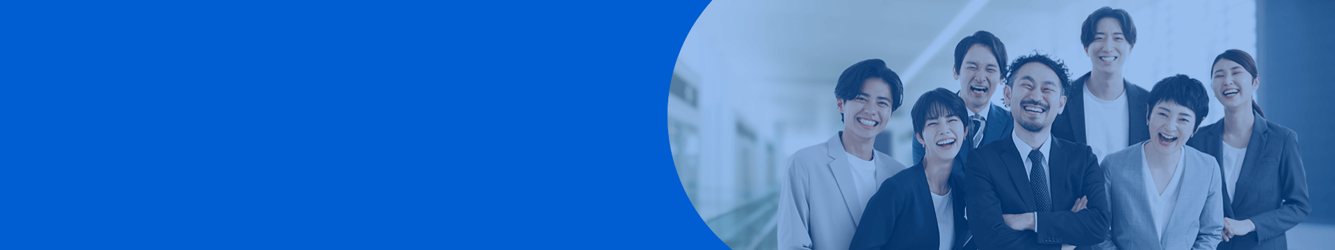 Visual accompanying the message from the recruiter. Employees in suits conversing on the terrace in front of the office.