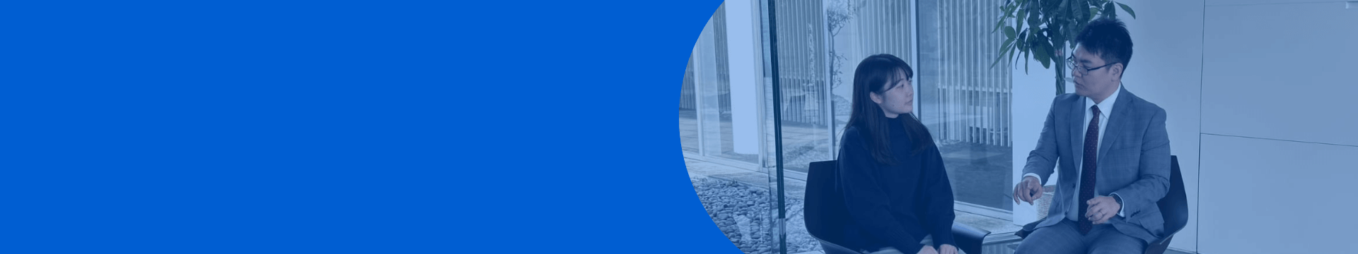 A visual accompanying a message from the recruiter, depicting employees in suits chatting on the terrace in front of the office.